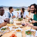 Happy group of friends enjoying a meal together